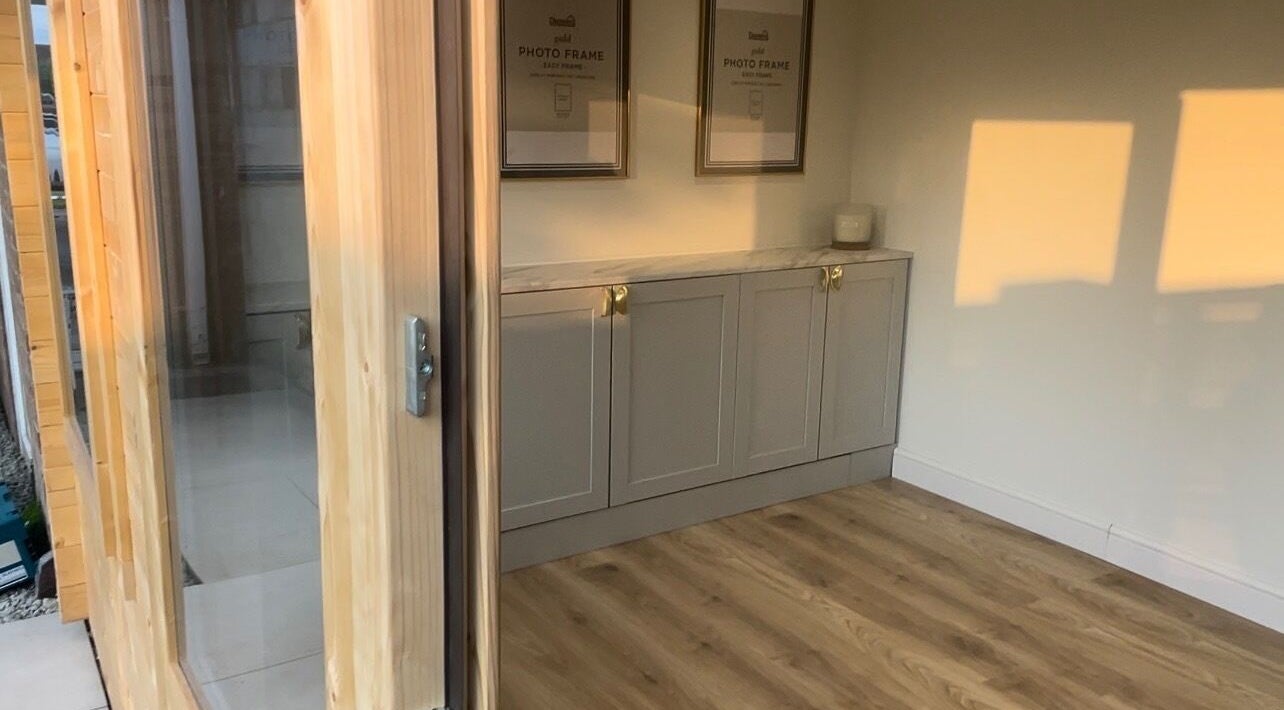 Elegant treatment room at No. 1 Beauty in Whitfield, England, GB, with wooden flooring and ambient lighting.