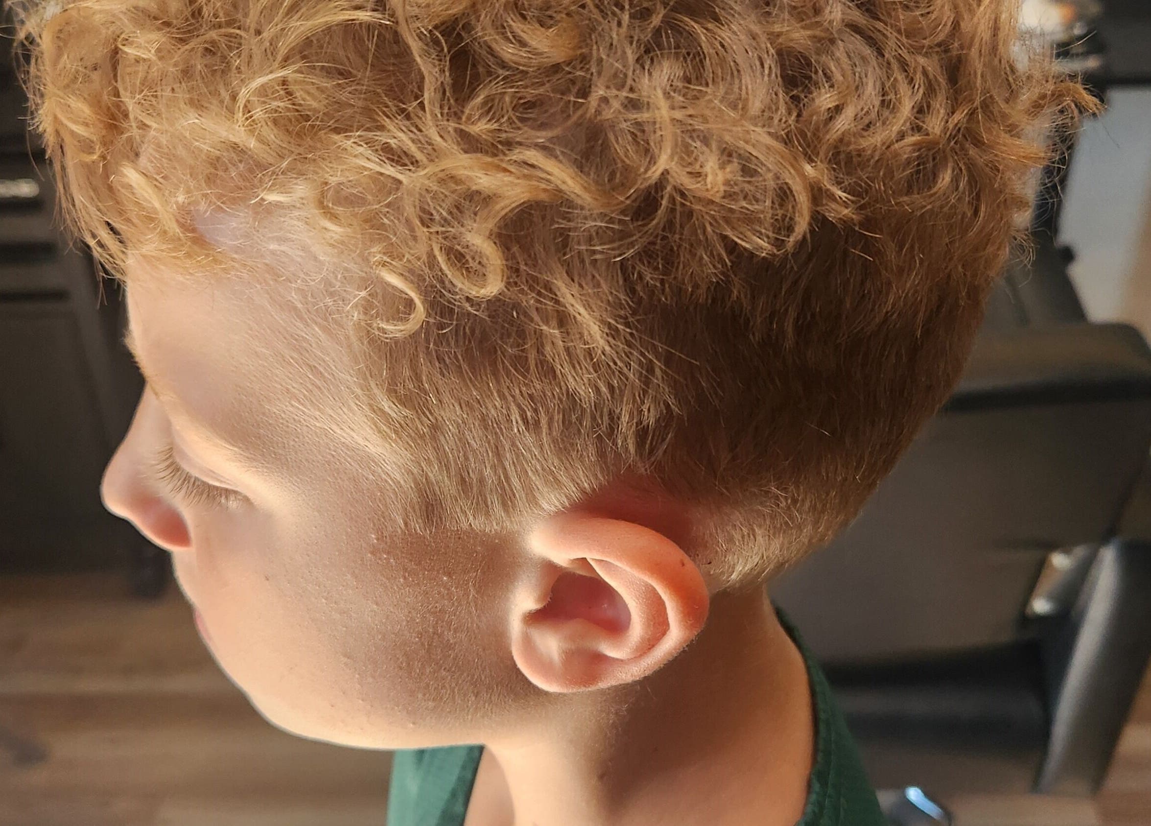Children's curly haircut at Fidelis Creations in Mabank, Texas, US. Perfect styling for young clients.