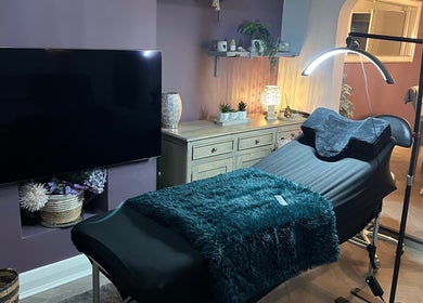 Relaxing spa treatment room at 888 Beauty by Jess, Ellesmere Port, England, GB, with cozy decor and treatment bed.