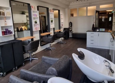 Interior of Bradley Rose Hair salon in Melbourne, Victoria, AU with modern chairs and styling stations.