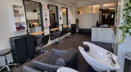 Interior of Bradley Rose Hair salon in Melbourne, Victoria, AU with modern chairs and styling stations.