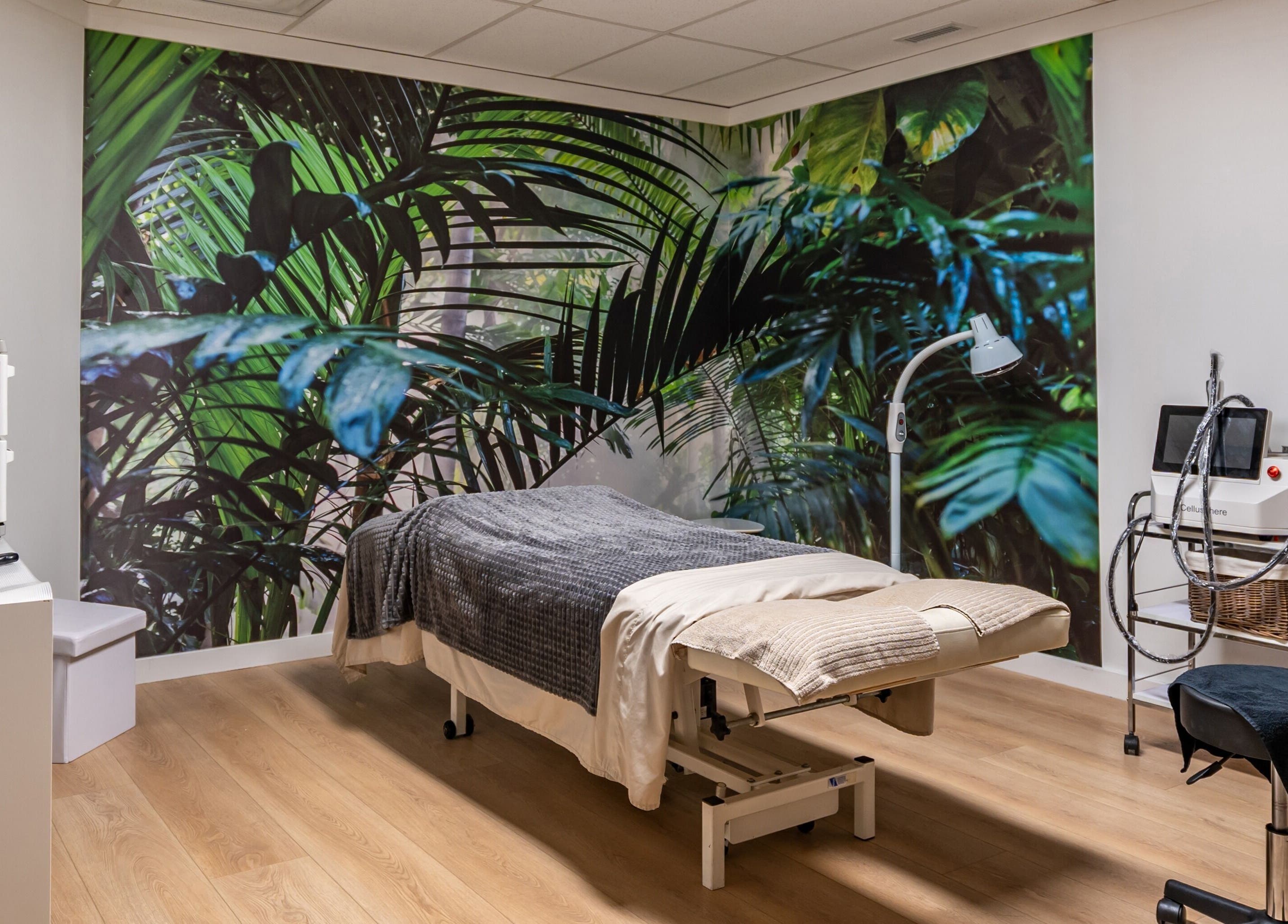 Tranquil massage room with tropical mural at ERA Massage & Beauty in Calgary, Alberta, CA.
