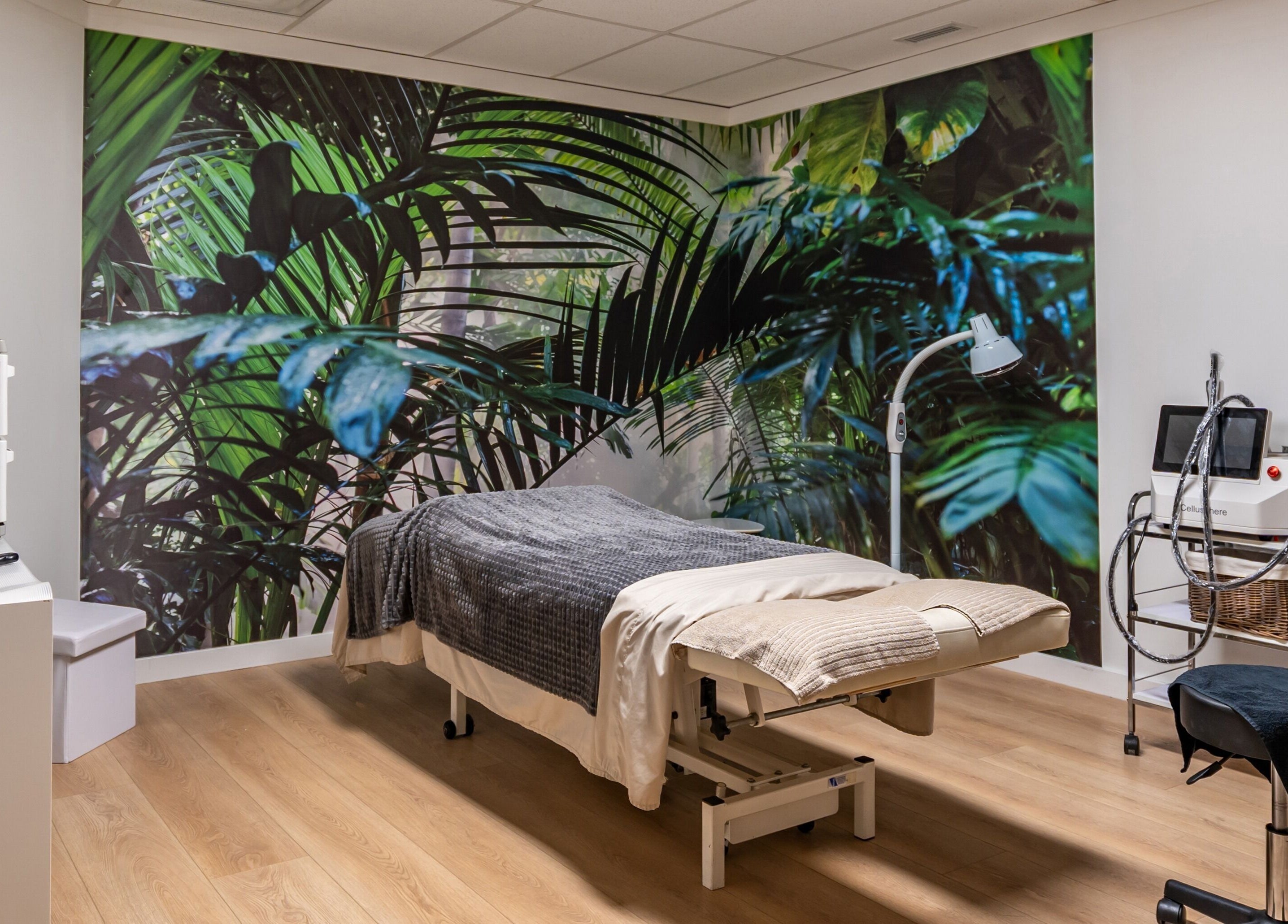 Tranquil massage room with tropical mural at ERA Massage & Beauty in Calgary, Alberta, CA.