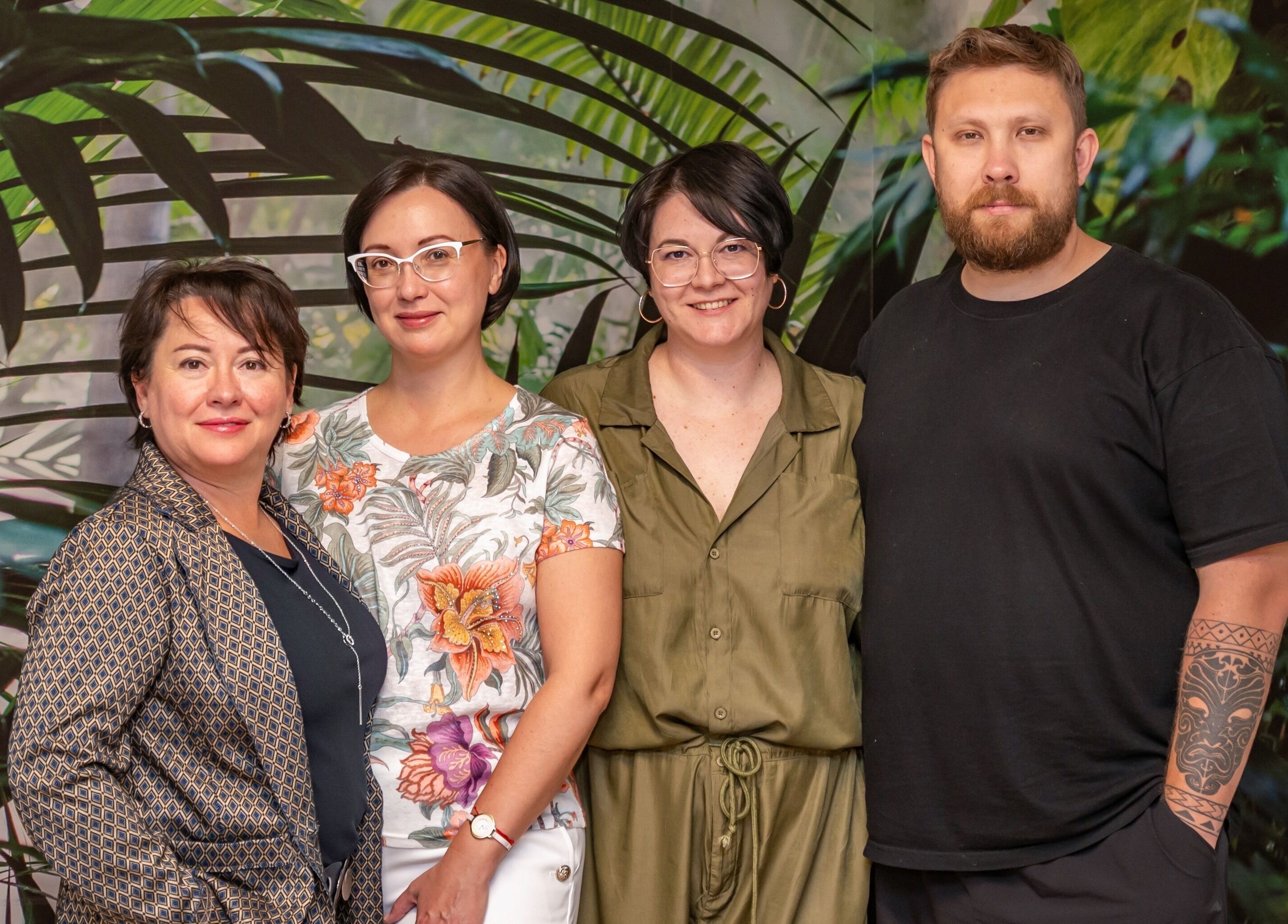 Friendly team of ERA Massage & Beauty in Calgary, Alberta, CA, standing in a lush, green backdrop.