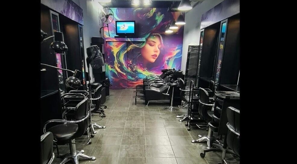 Interior of Mary Hair Artistry in Johannesburg, Gauteng, ZA with colorful mural and styling chairs.