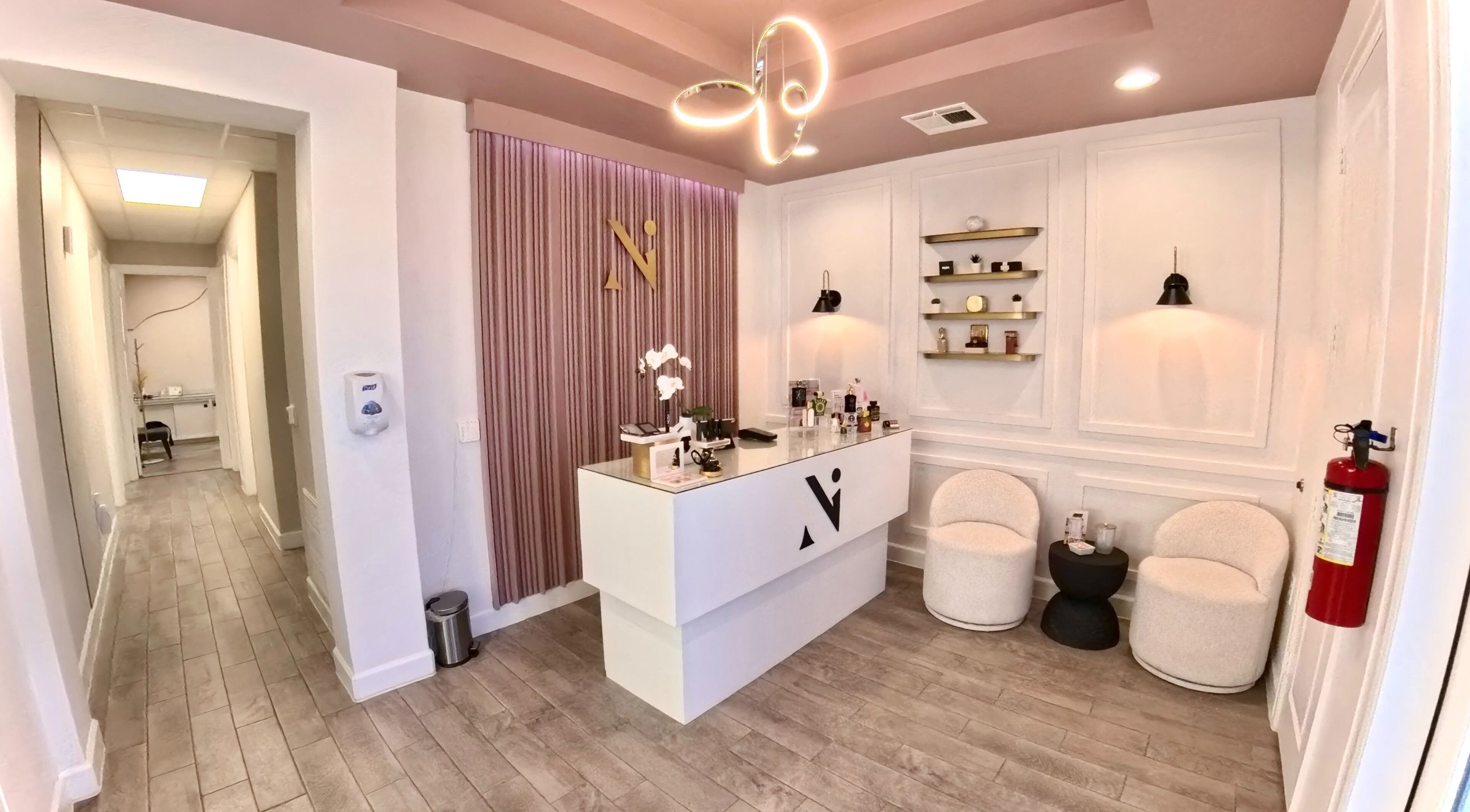 Elegant reception area at Nadia Isabel Studio, Katy, Texas, US showcasing modern decor and ambient lighting.