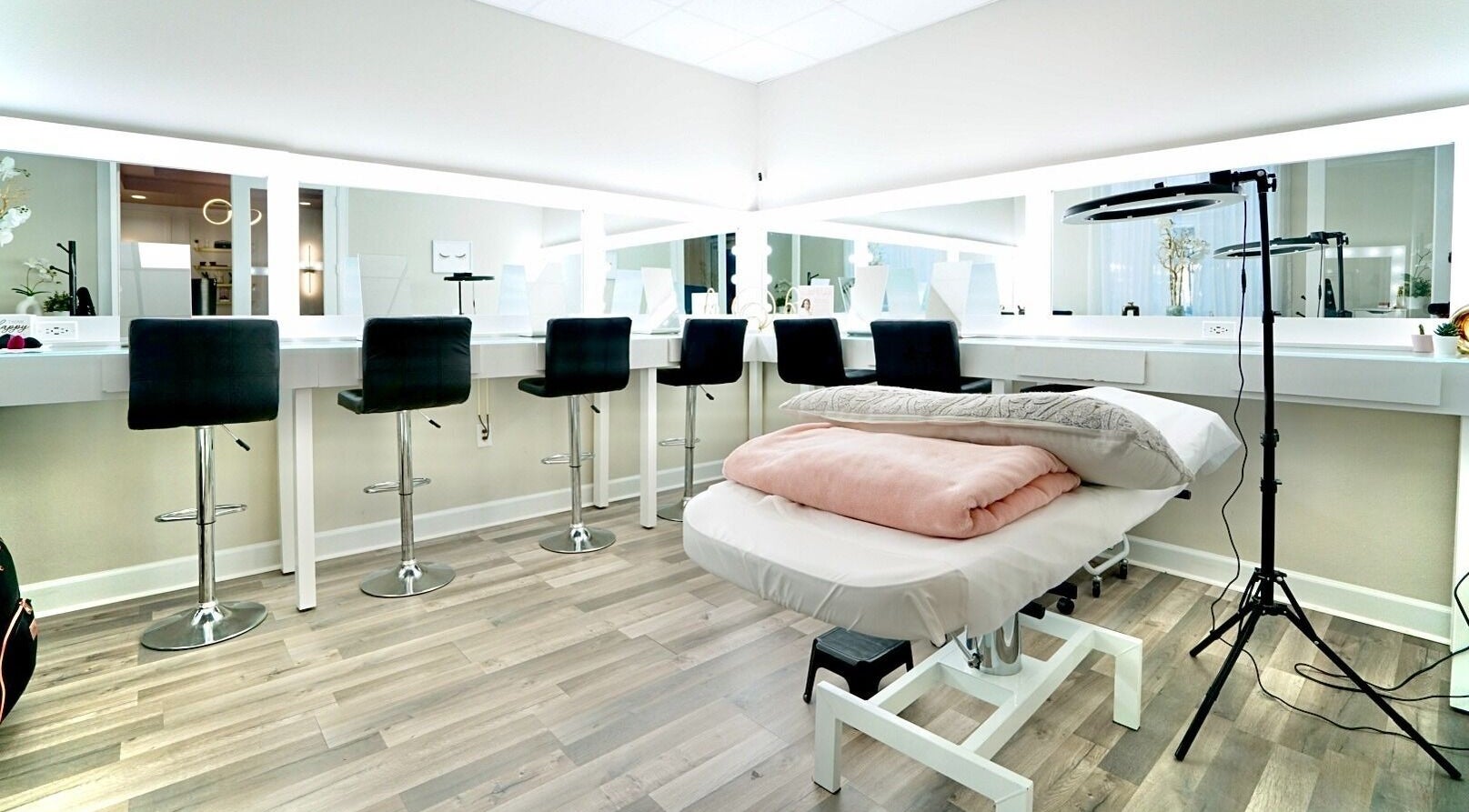 Modern beauty room at Nadia Isabel Studio in Katy, Texas, US, featuring stylish seating and bright lighting.
