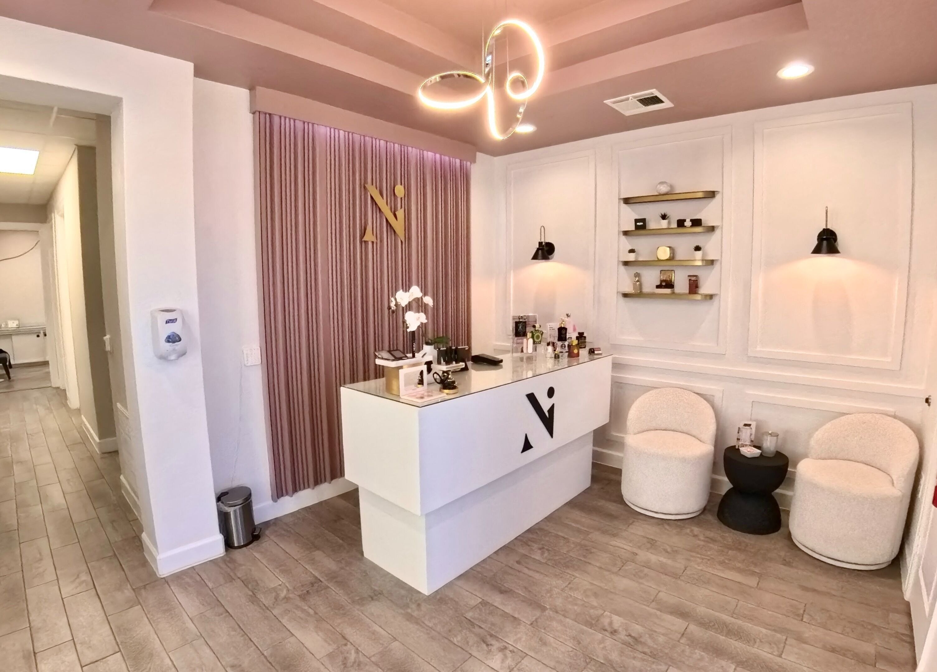 Entrance of Nadia Isabel Studio in Katy, Texas, US, featuring a modern reception area with stylish decor.