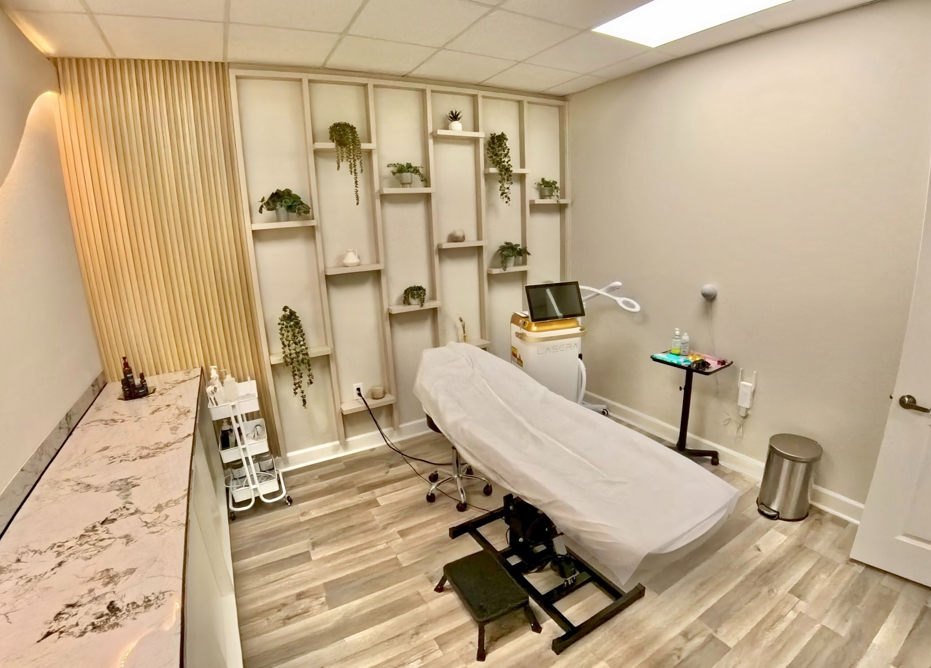 Relaxing treatment room at Nadia Isabel Studio, Katy, Texas, US featuring modern decor and spa bed.
