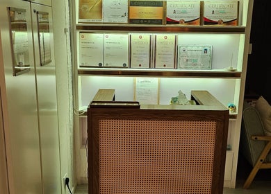 Magic Forest reception in Kowloon, HK, with certificates on display showcasing wellness expertise.