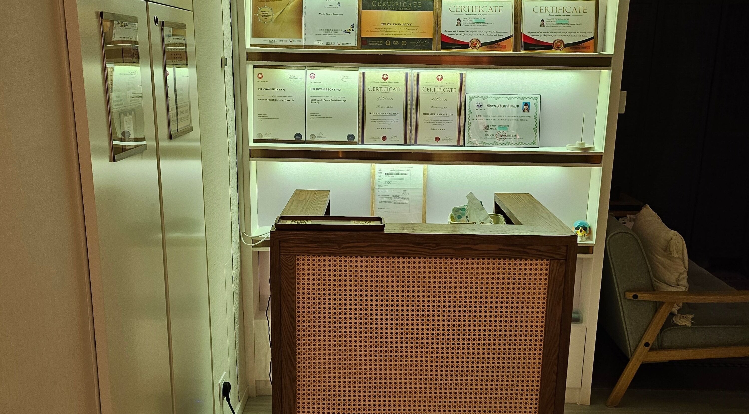 Magic Forest reception in Kowloon, HK, with certificates on display showcasing wellness expertise.