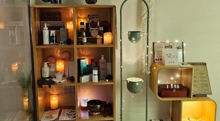Candles and beauty products creating a calming ambiance at Magic Forest in Kowloon, HK.