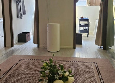 Peaceful spa room at Magic Forest, Kowloon, HK with relaxing decor and natural light.