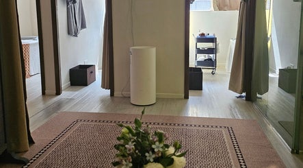Peaceful spa room at Magic Forest, Kowloon, HK with relaxing decor and natural light.