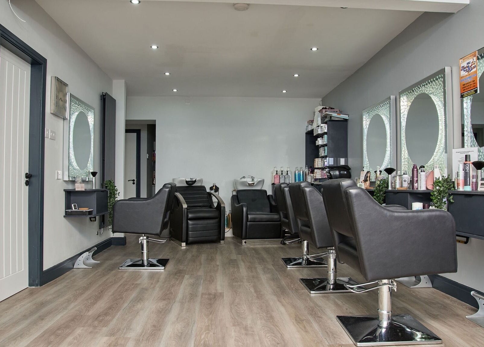Modern styling chairs and mirrors at Liz Lewis Hair Studio, Chorley, England, GB.