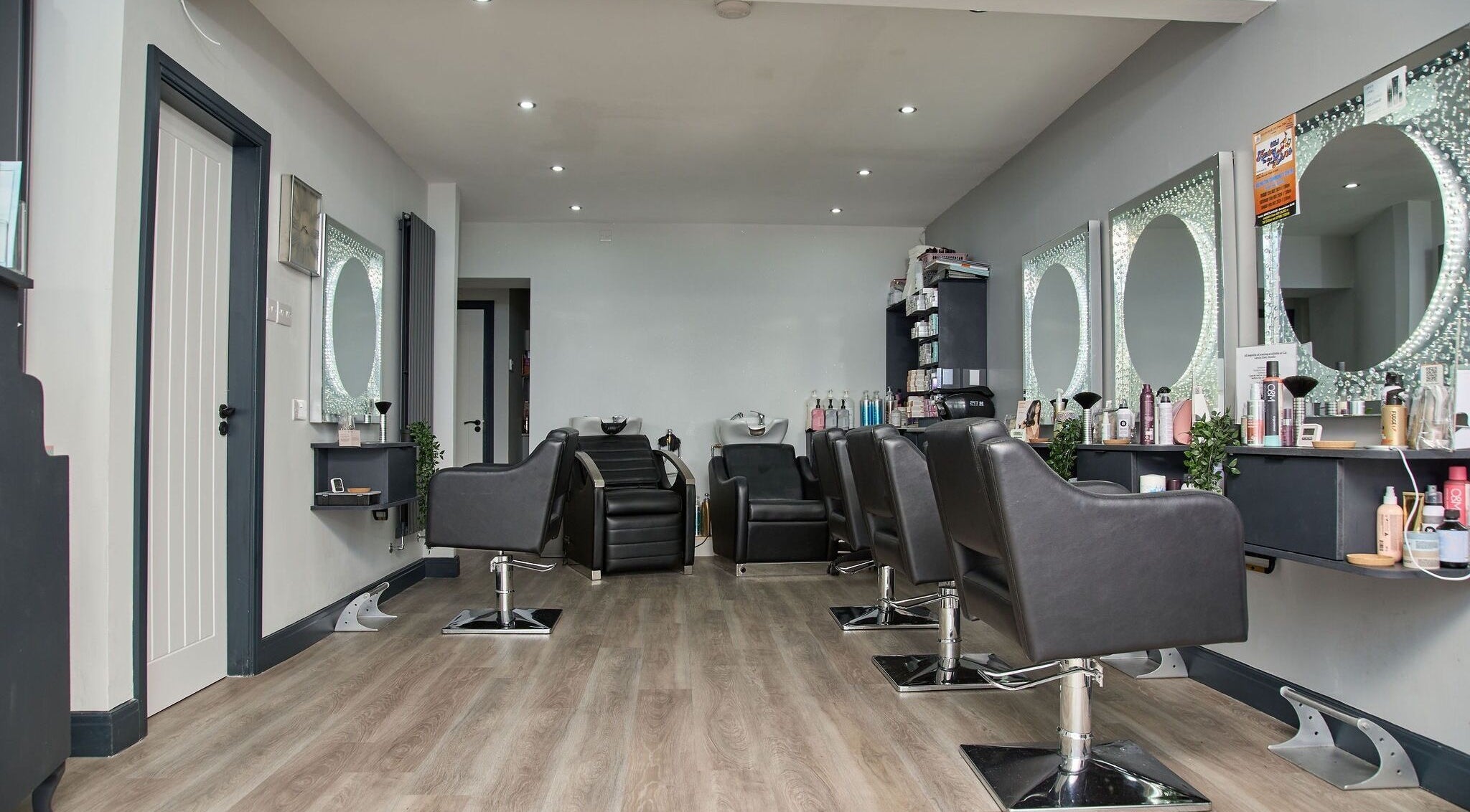 Modern styling chairs and mirrors at Liz Lewis Hair Studio, Chorley, England, GB.
