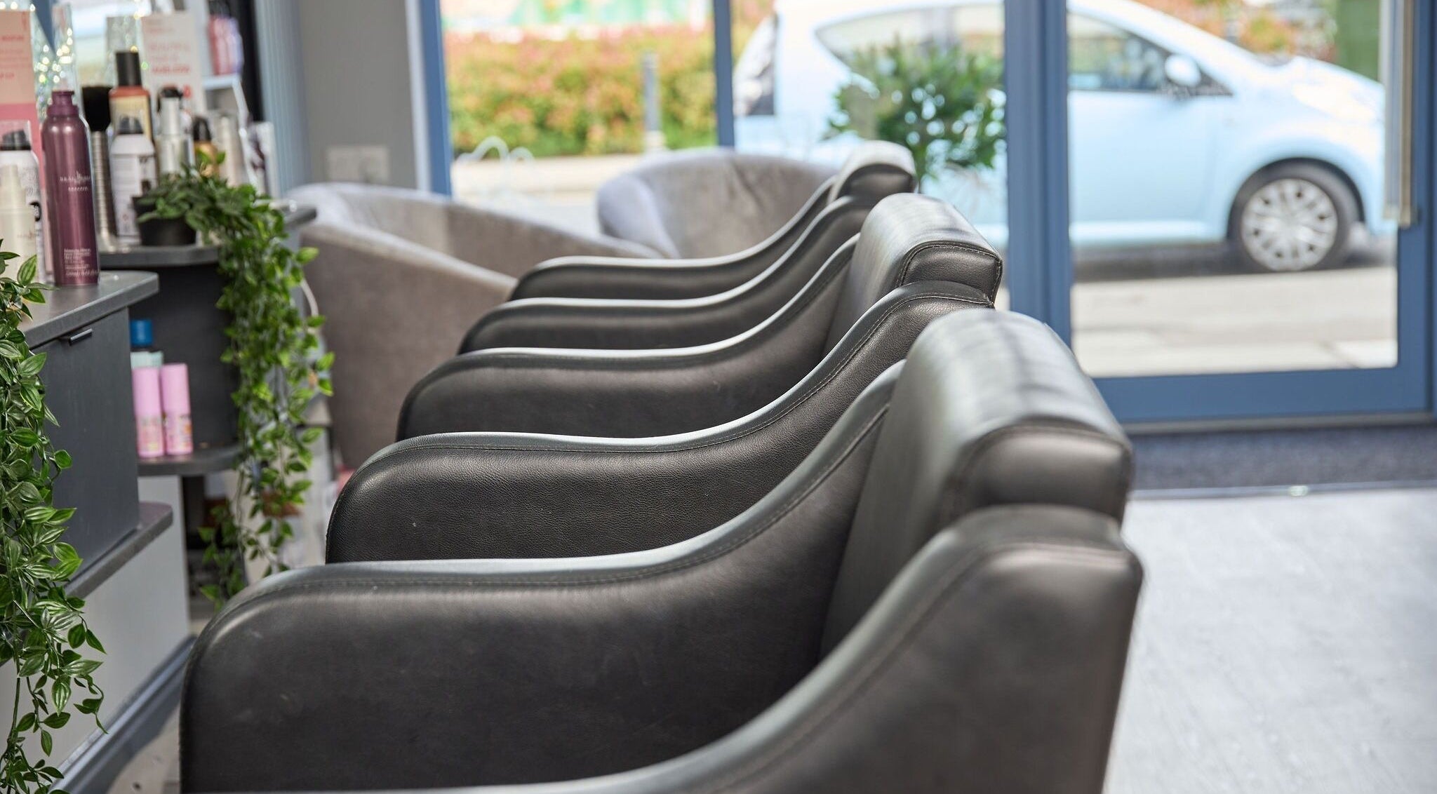 Luxury seating at Liz Lewis Hair Studio in Chorley, England, GB, showcasing elegant interior design.