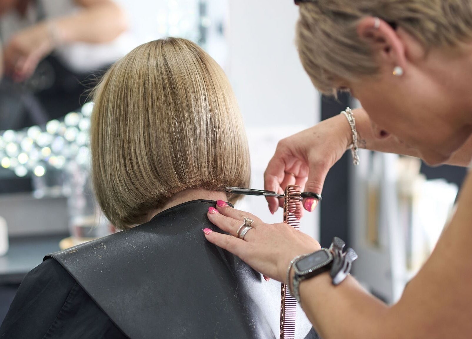 Stylist cutting a bob hairstyle at Liz Lewis Hair Studio, Chorley, England, GB.