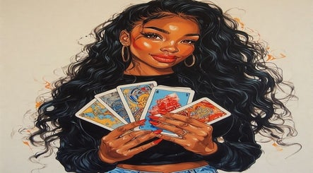 A woman holding tarot cards at Fly Taurus Enchantress Tarot, Boyds, Maryland, US.