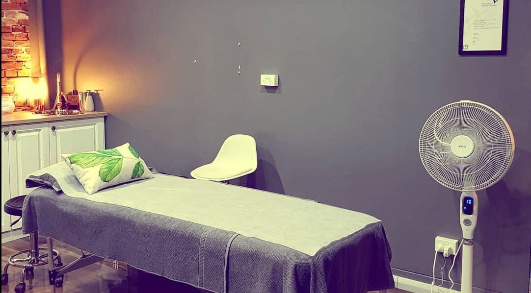 Calm treatment room at Skinroom by Mandi in Narwee, New South Wales, AU with bed and fan.