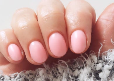 Elegant pink manicure at Cody's nail boutique in Portsmouth, England, GB, showcasing quality nail services.