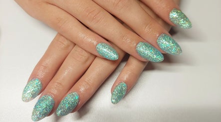 Glittery manicured nails at Cody's nail boutique, Portsmouth, England, GB, showcasing chic nail art.