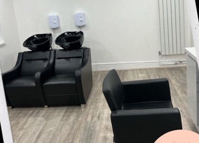 Modern salon chairs at Chax Salon | Waterloo Road in Stoke-on-Trent, England, GB enhance the luxurious ambiance.