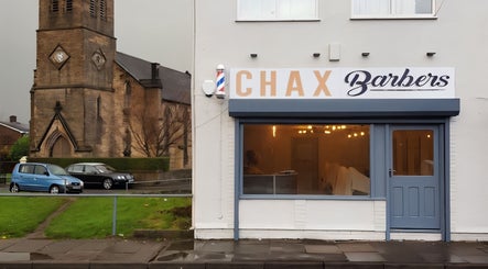 Chax Barbers on Waterloo Rd, Stoke-on-Trent, England, a modern barber shop with welcoming exterior.