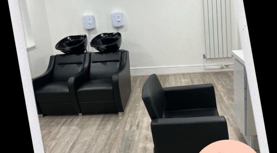 Modern wash stations at Chax Salon | Waterloo Road, Stoke-on-Trent, England, GB, with sleek black chairs.