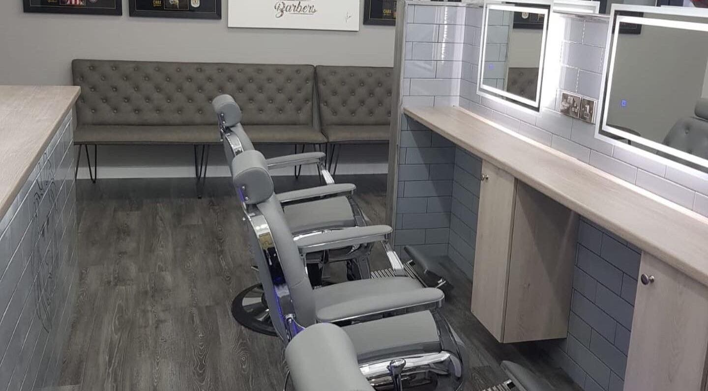 Chax Barbers | Queen Street features sleek chairs in Stoke-on-Trent, England, GB's modern grooming space.