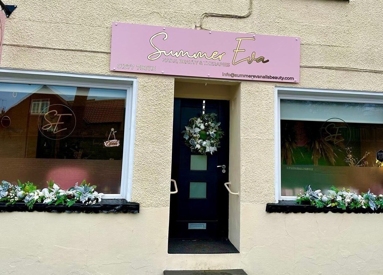 Entrance of Summer Eva Nafferton, a beauty venue in Nafferton, England, GB, decorated with floral arrangements.