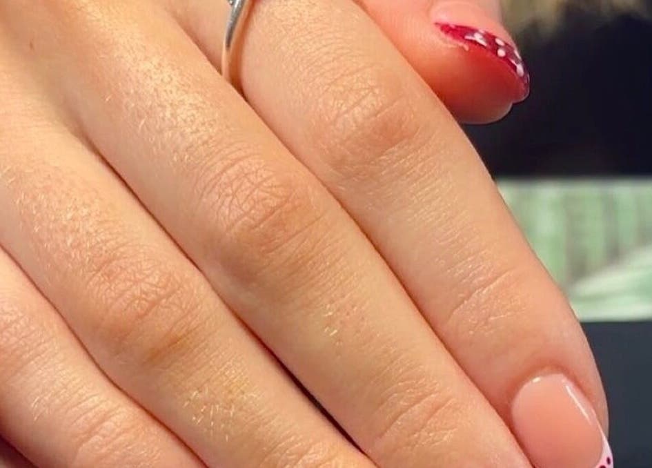 Manicured nails with a ring at Summer Eva Nafferton, Nafferton, England, GB showcasing vibrant nail art.