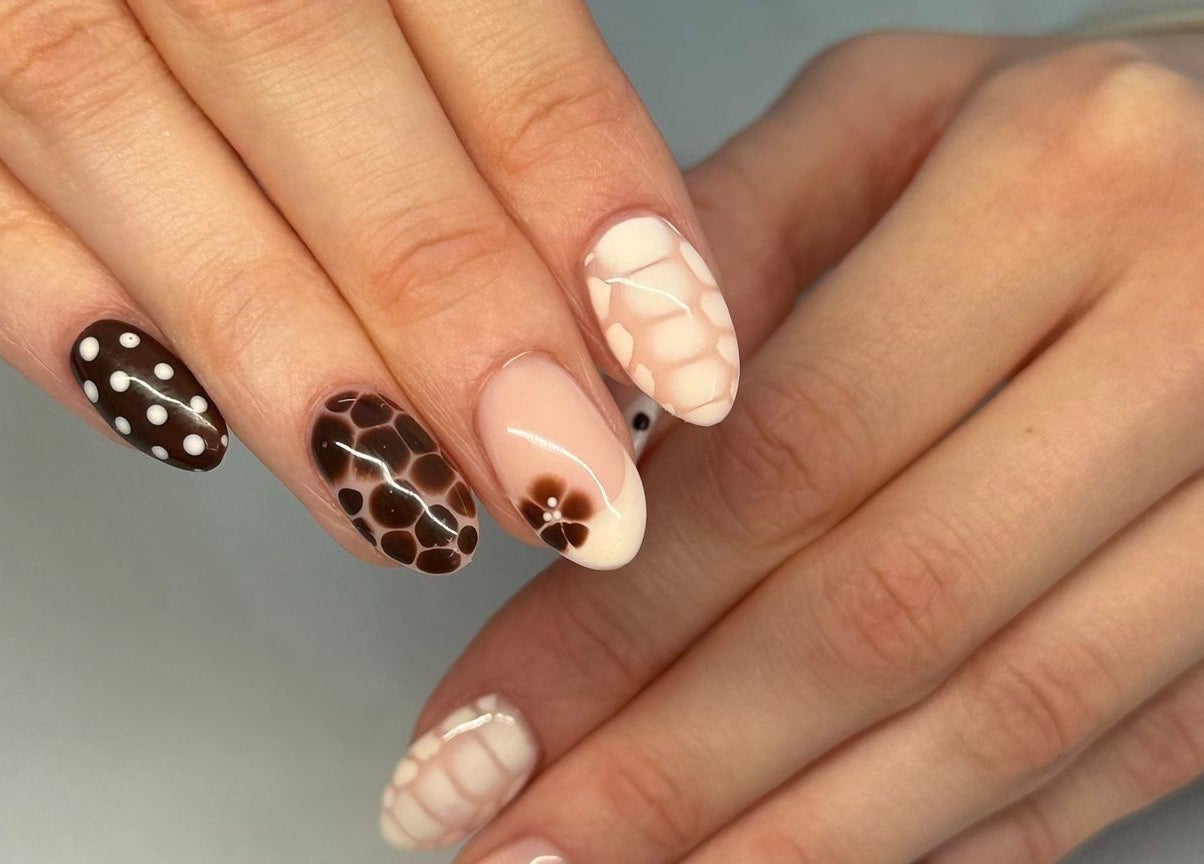 Elegant nail art at Summer Eva Cranswick, Hutton Cranswick, England, GB; featuring unique floral and polka dot designs.