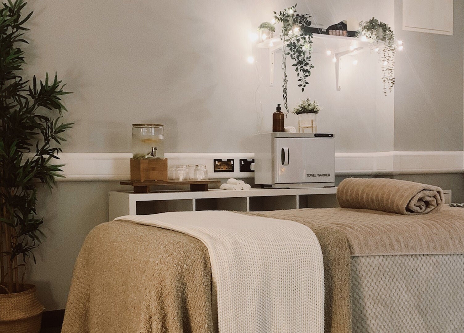 Relaxing massage room at HB Holistic Massage, Belfast, Northern Ireland, GB, with cozy decor and a massage table.