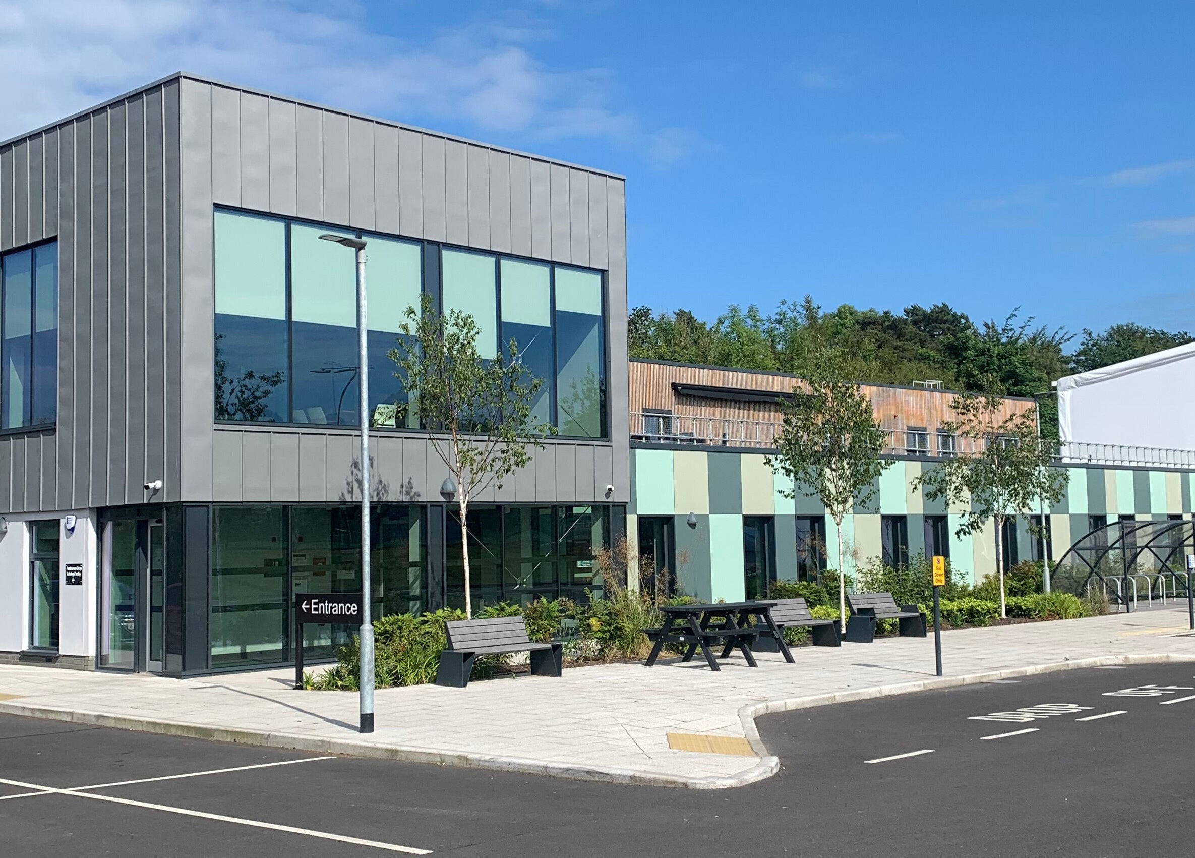 Front view of HB Holistic Massage at Newforge complex, Belfast, Northern Ireland, GB, featuring modern architecture.