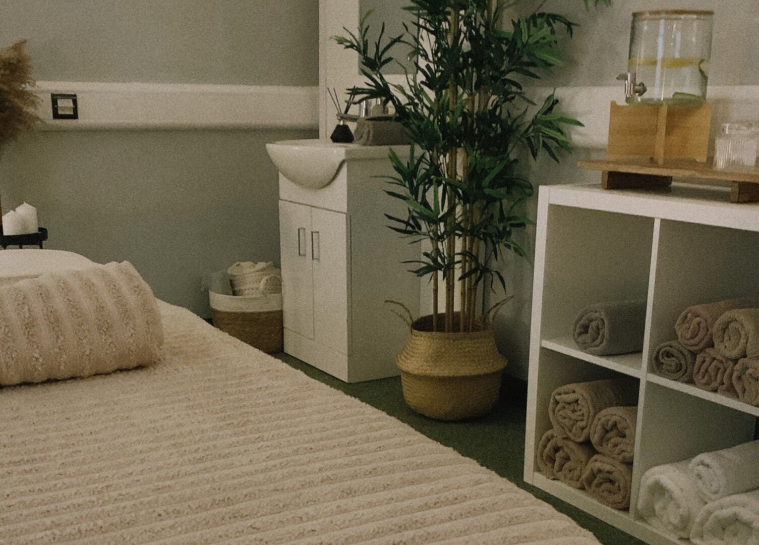 Calm massage room at HB Holistic Massage in Belfast, Northern Ireland, GB with cozy decor and soft lighting.