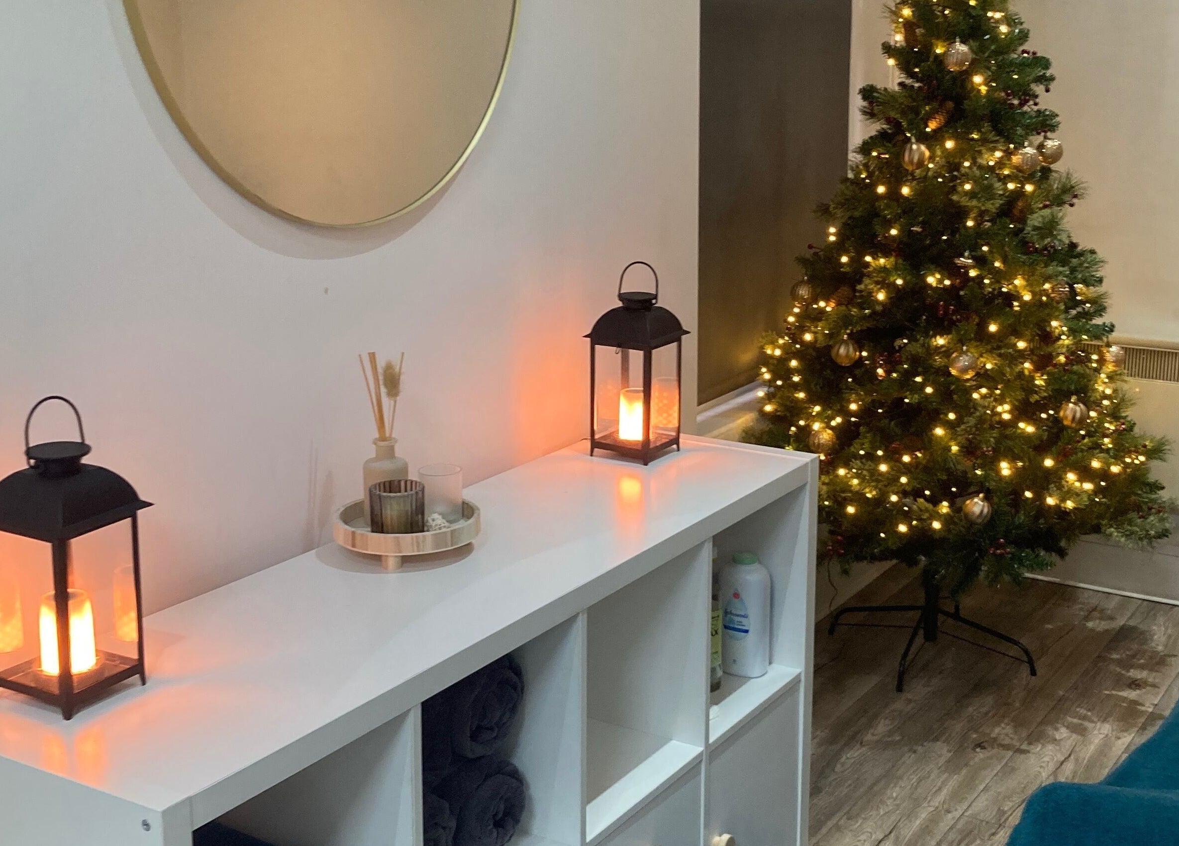 Cozy festive corner at Nirvana Massage Therapy (New Location!), Aberdeen, Scotland, GB with a glowing tree.