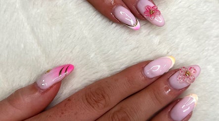 Decorative nail art with pink floral designs at 𝐆𝐋𝐎𝐖 𝐁𝐲 𝐌𝐚𝐝𝐬, Abbots Langley, England, GB.