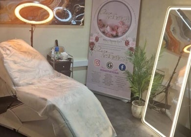 Cozy treatment room at Glow by Mads @ Rosa Aesthetics, Hemel Hempstead, England, GB with plush chair and ornate decor.