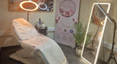 Cozy treatment room at Glow by Mads @ Rosa Aesthetics, Hemel Hempstead, England, GB with plush chair and ornate decor.