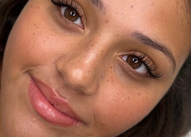 Close-up of a woman's face with natural makeup at Glow by Mads @ Rosa Aesthetics in Hemel Hempstead, England, GB.