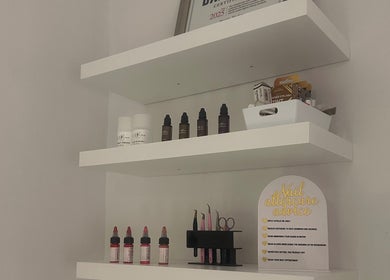 Organized beauty product shelves at GLOW By Mads, Abbots Langley, England, GB showcasing elegant simplicity.