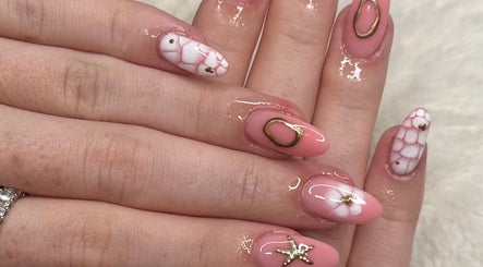 Elegant nail art with pink and white designs at Glow by Mads, Abbots Langley, England, GB.