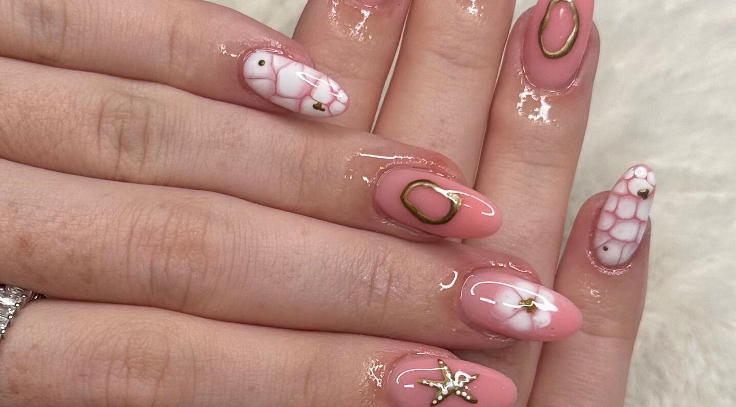Elegant nail art with pink and white designs at Glow by Mads, Abbots Langley, England, GB.