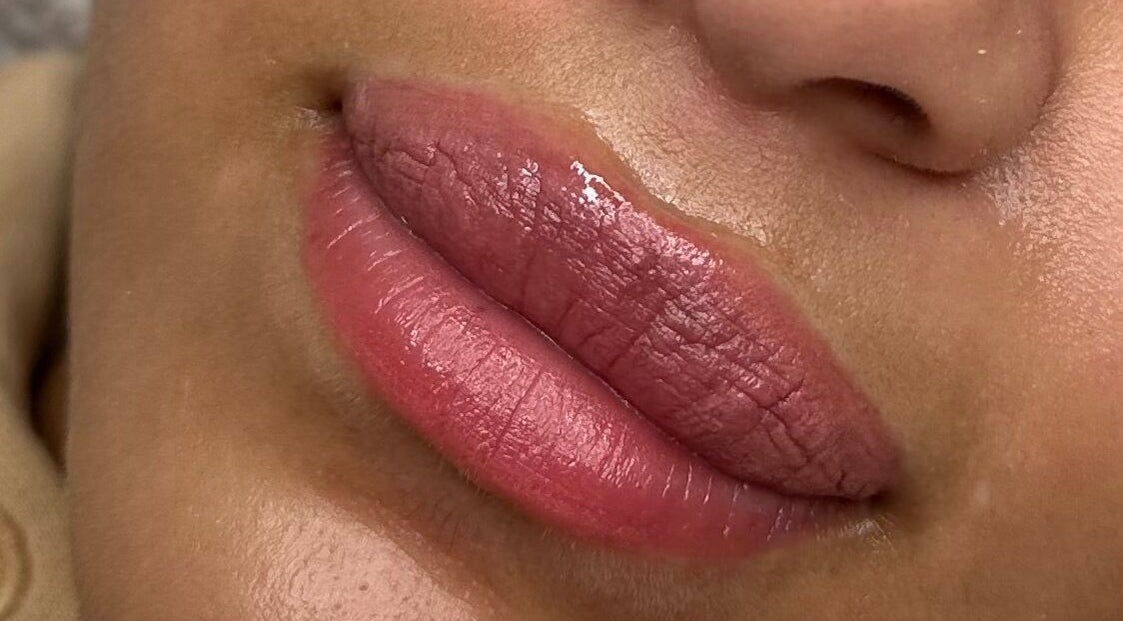 Close-up of lush, glossy lips at Glow by Mads, Abbots Langley, England, GB