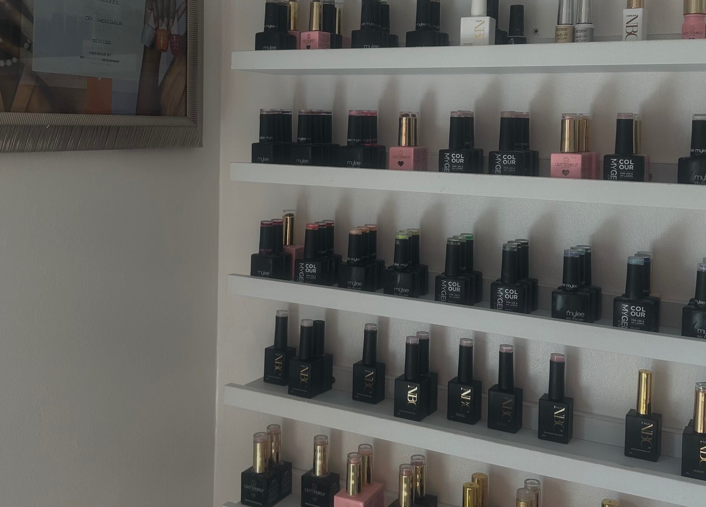 Nail polish display at Glow by Mads, Abbots Langley, England. A showcase of vibrant polish varieties.