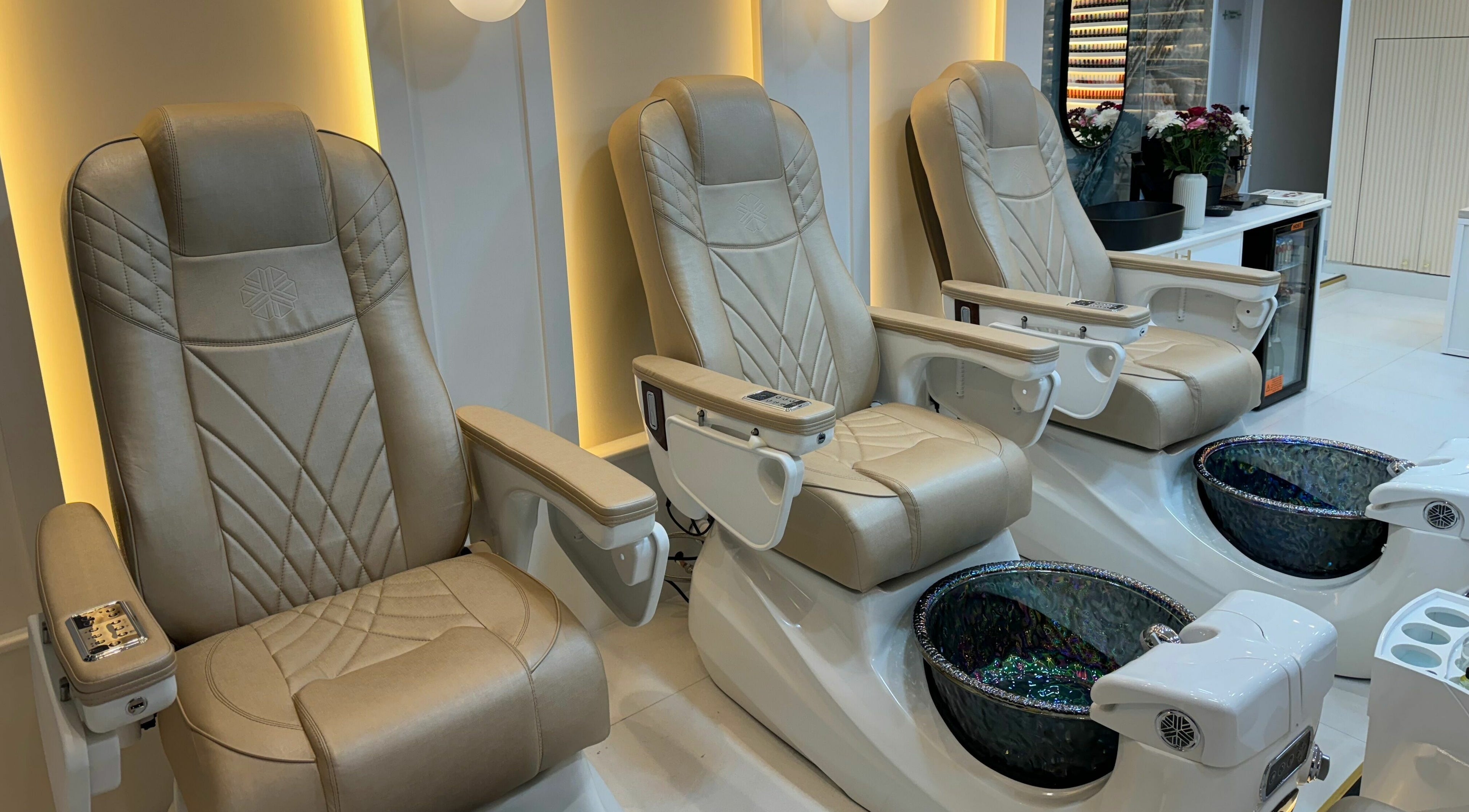 Luxurious pedicure chairs at Mau Beauty, London, England, GB offering a relaxing experience.