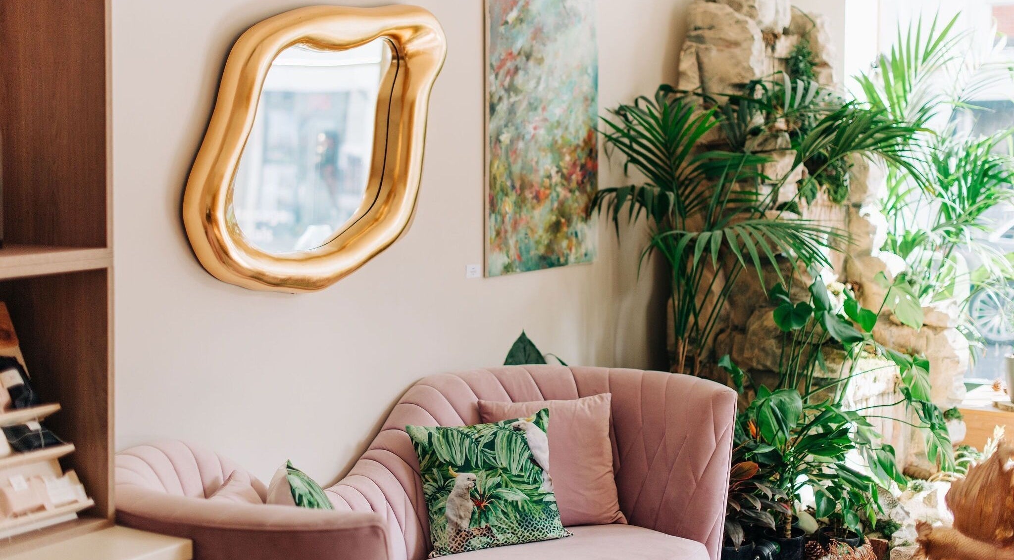 Luxurious pink seating and lush plants at Bayou Spa, London, England, GB, exude tranquility and elegance.
