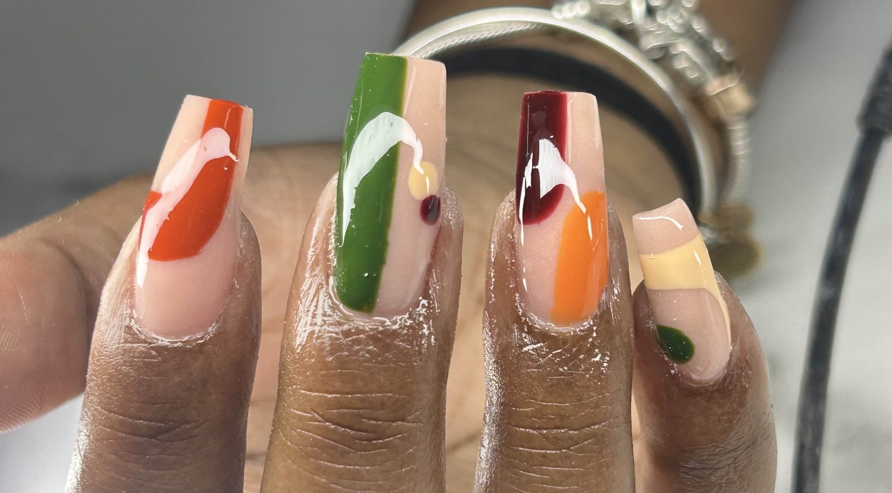 Vibrant nail design at Bahama Beauty Nail Bar, Nassau, New Providence, BS, showcasing bold hues and patterns.