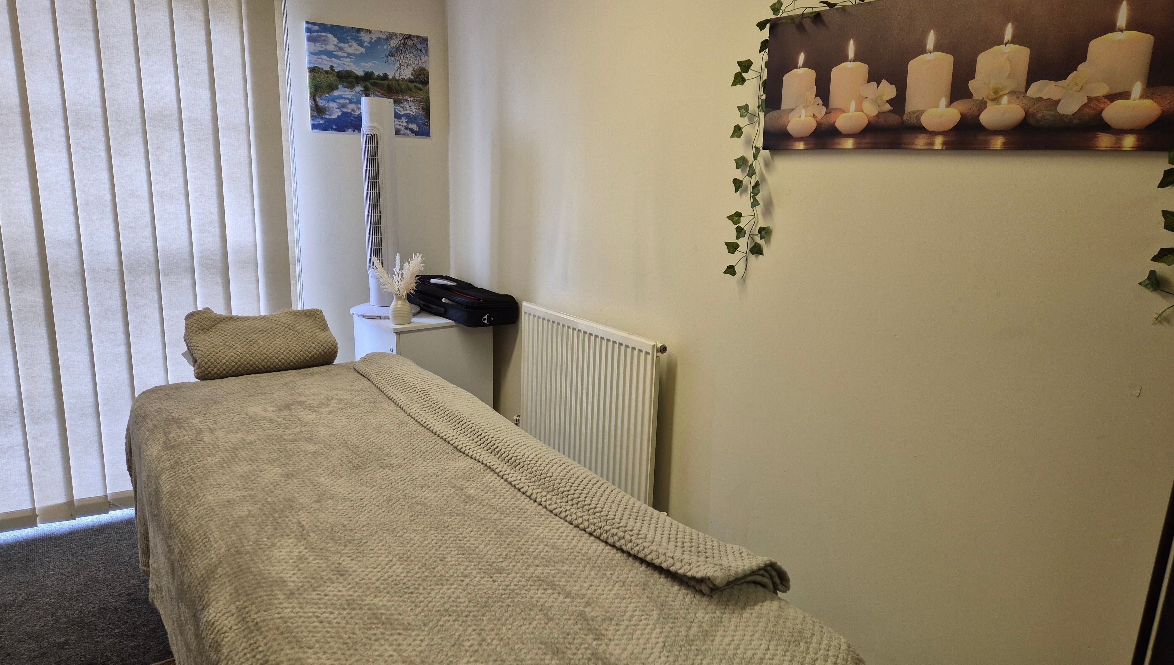 Calm treatment room at Mandi O'Neill Holistics, Goole, England, GB, with soft lighting and comfortable massage table.